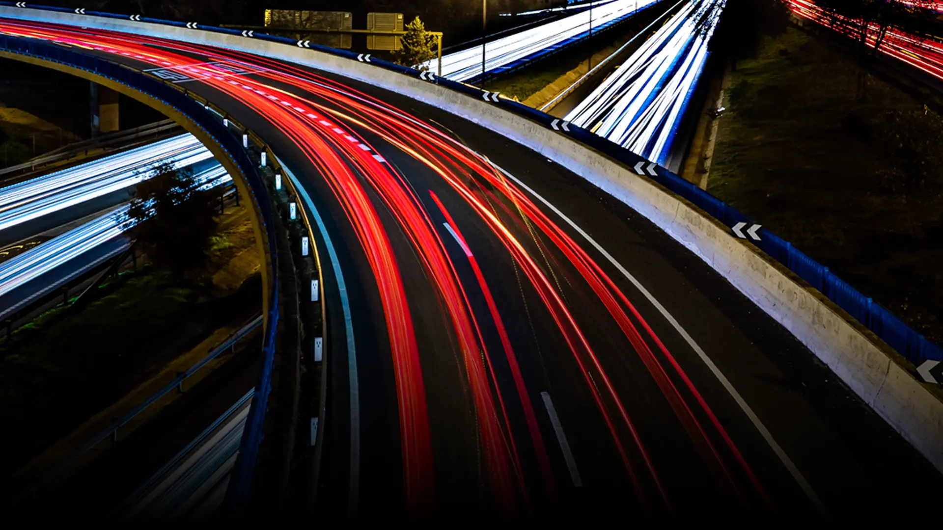 Car headlights and rear lights passing in opposite directions on a motorway