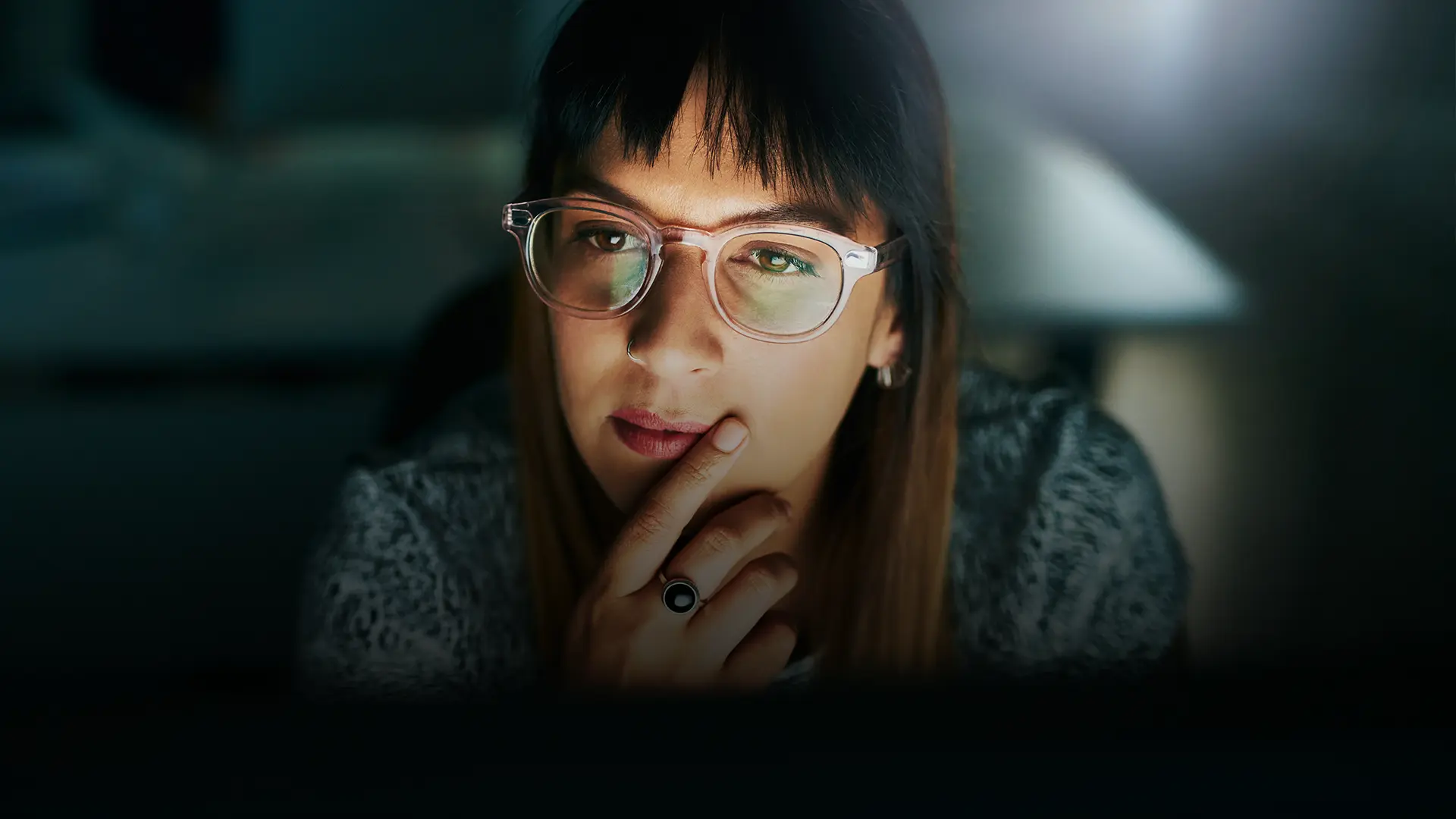 Person looking a laptop screen, participating in a BecomingX corporate development course