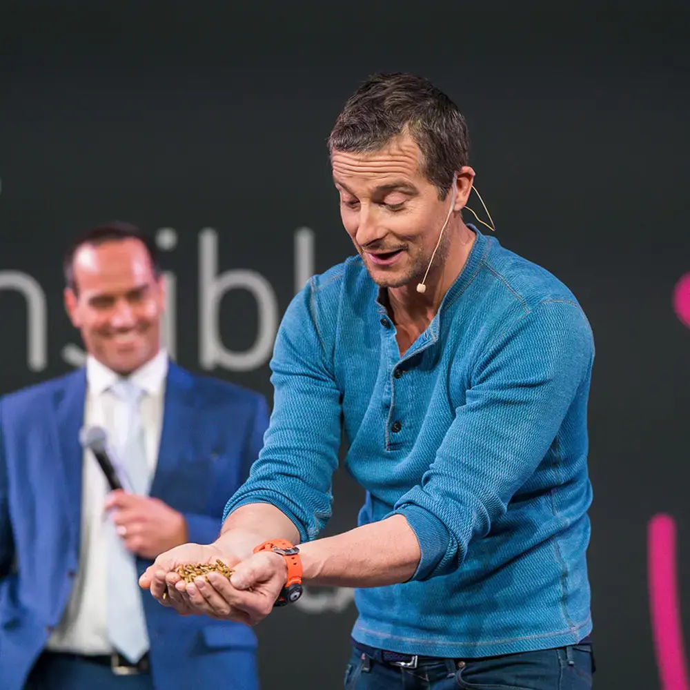 BecomingX co-founder Bear Grylls presenting on stage at BETT