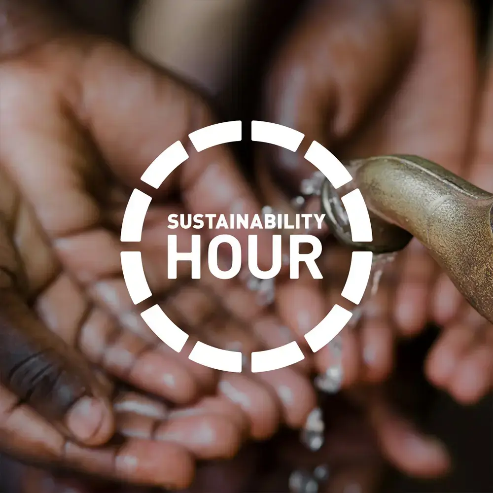 A Sustainability Hour logo in white, overlaid upon an image of hands being washed at a tap behind.