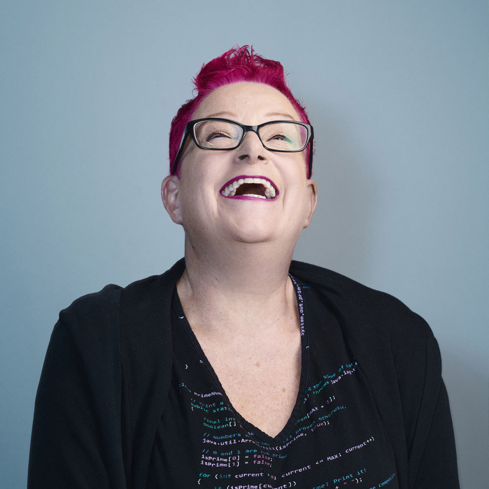 Portrait of computer science and technology Professor, Sue Black, laughing.