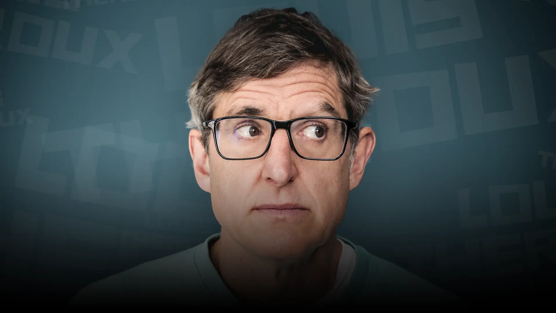 Louis Theroux looking away to his left