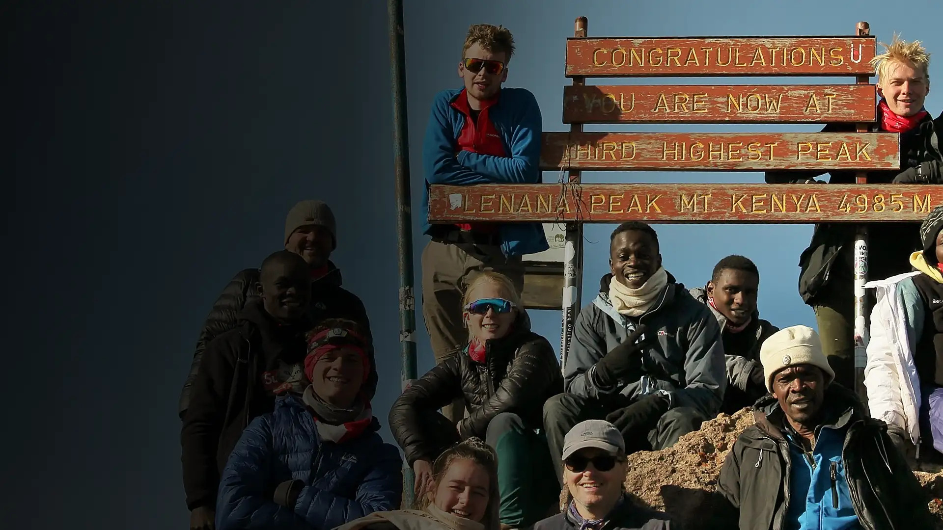 A group of students who have made it to the top of Mount Kenya on a BecomingX Education expedition.