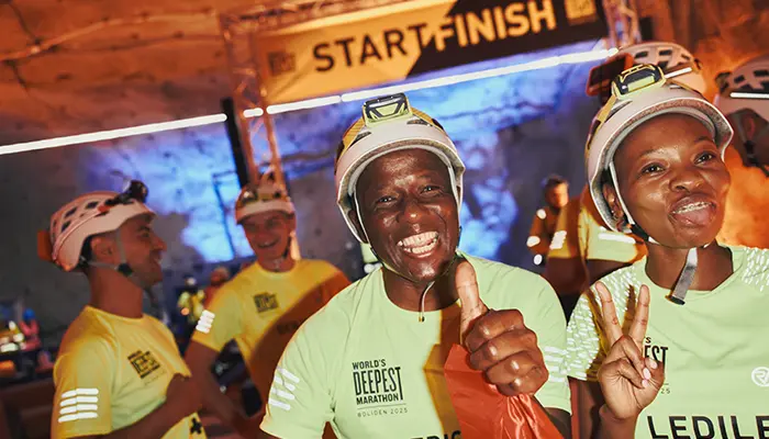 Participants celebrate completing the World's Deepest Marathon